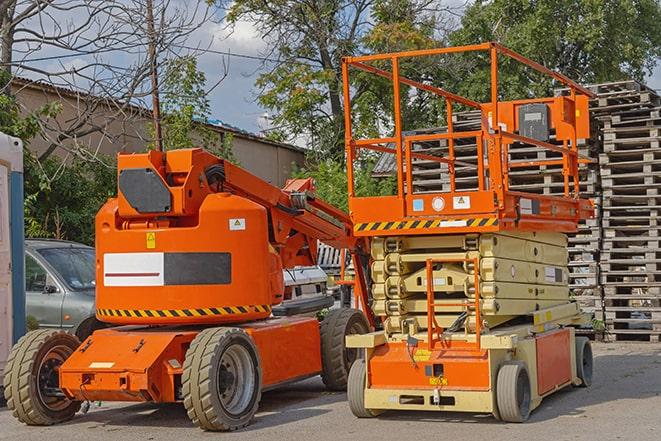 forklift moving crates in a large warehouse in Bruce, MI